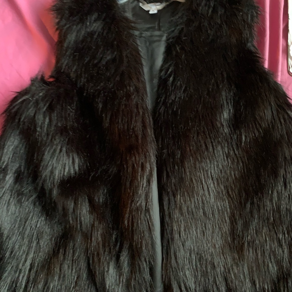 Black furry vest.